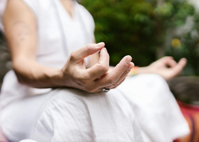 Close up of yoga practitioner hands in a mudra position
